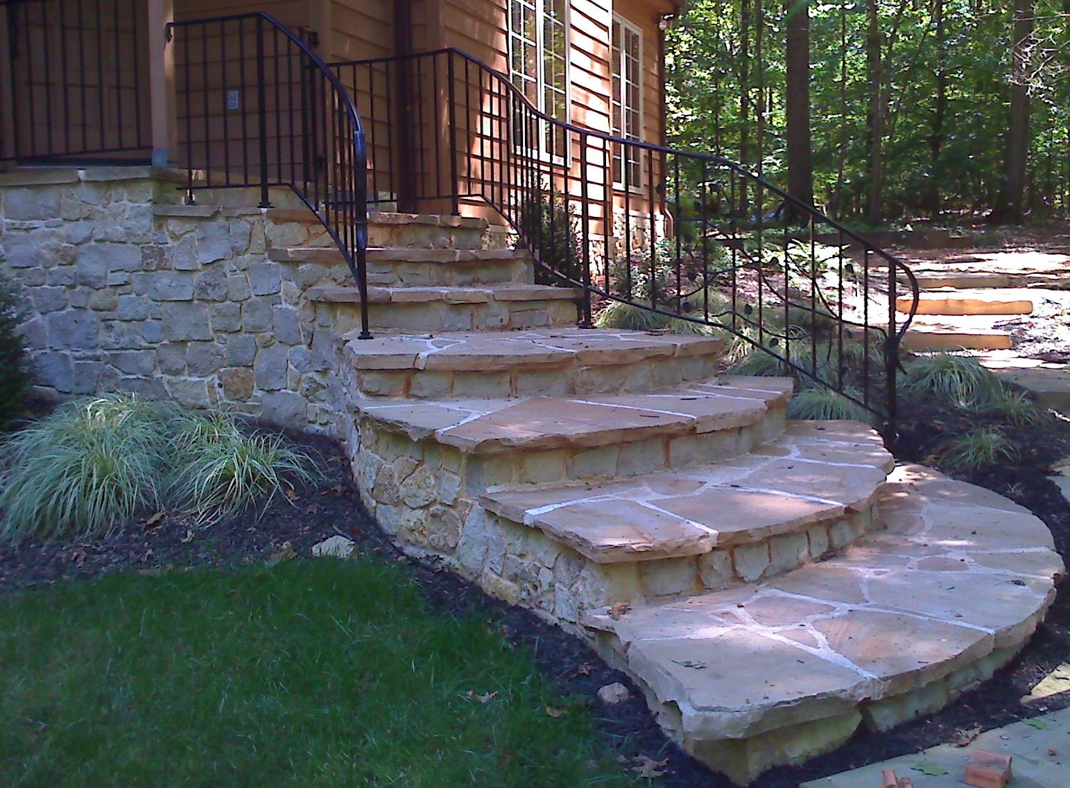 WildWorks stone steps through a wooded garden